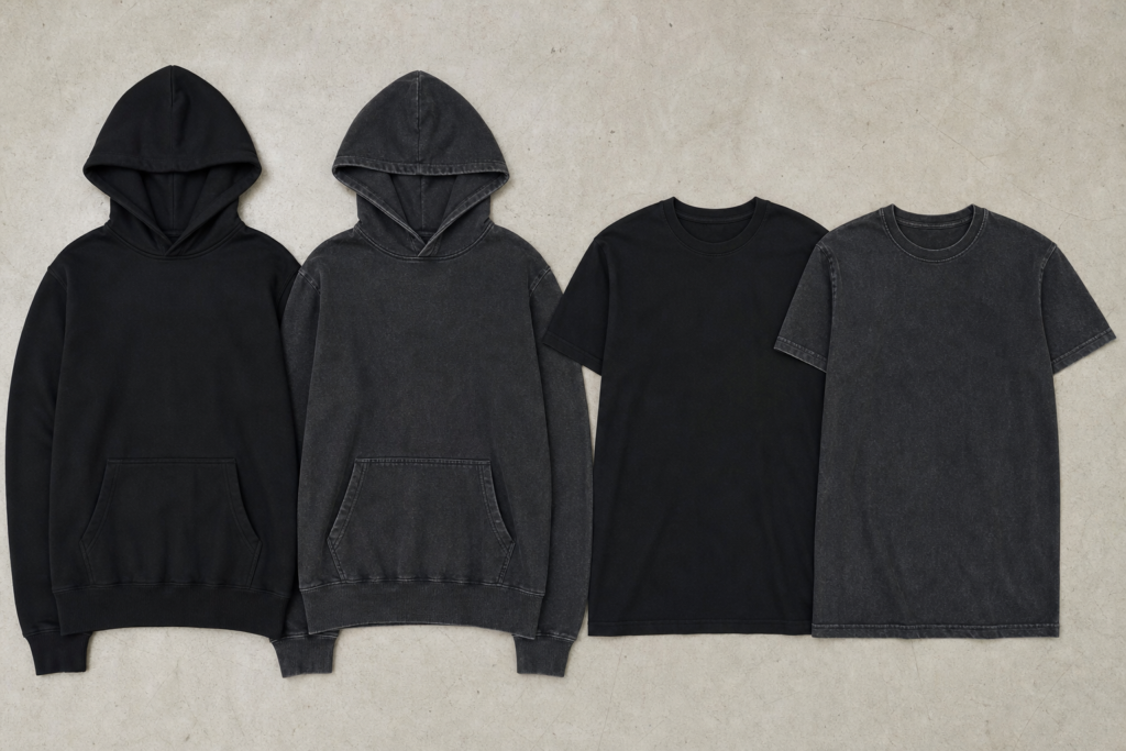 New and washed hoodies and T-shirts laid side by side to show how washing can change garment color and shade